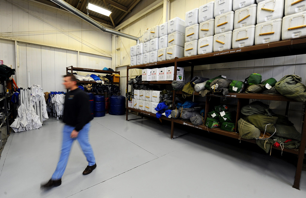 Restaurant walk-in cooler shelves stocked with supplier cases