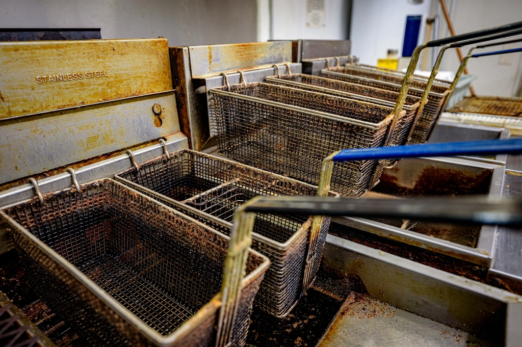 Commercial deep fryer in a restaurant kitchen