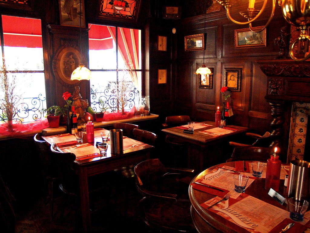 Interior of a restaurant dining room set for service