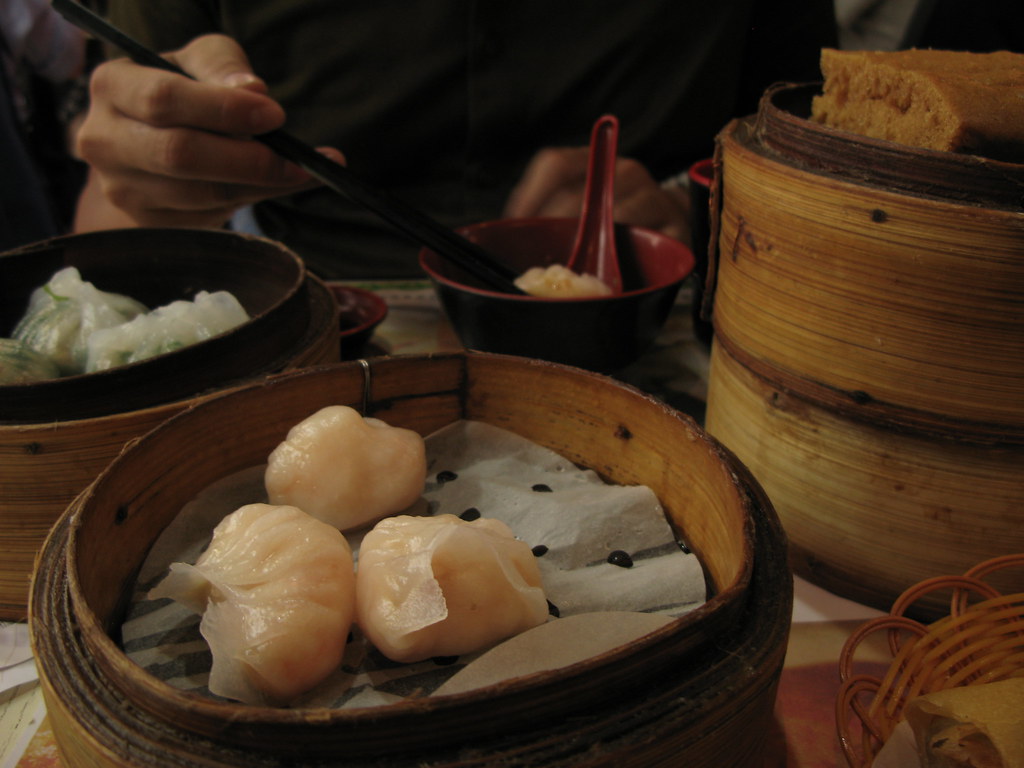 Bamboo steamer baskets of dim sum on a restaurant table