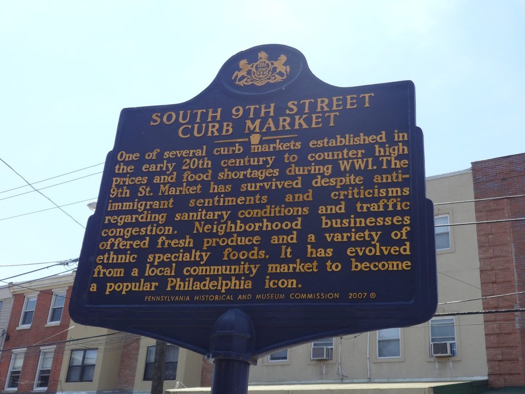 Awnings and produce stands along South 9th Street in Philadelphia's Italian Market