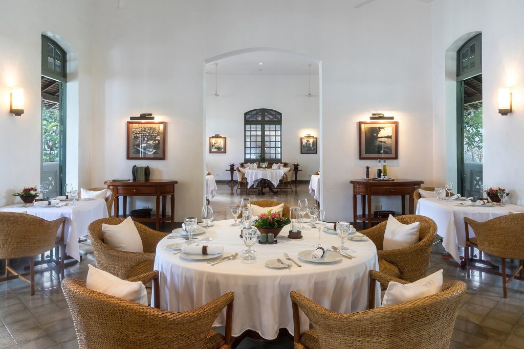 An empty restaurant dining room with set tables