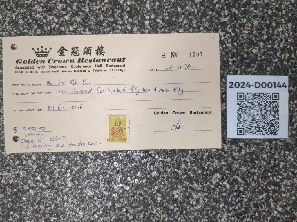 A printed restaurant receipt beside a card terminal