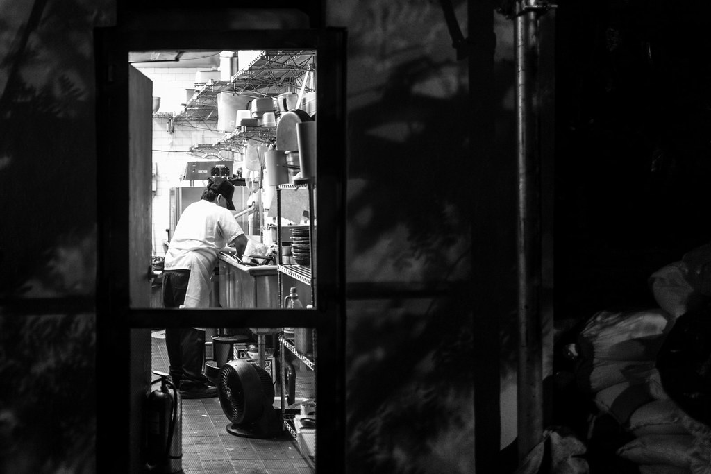 Line cook working in a restaurant kitchen