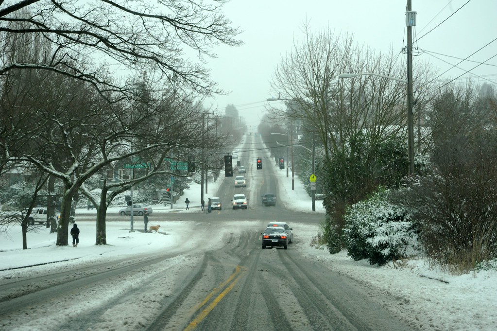 Just a few cars and trucks, out for a walk with a dog, Snowy streets of Wallingford, south of Greenlake, Seatt
