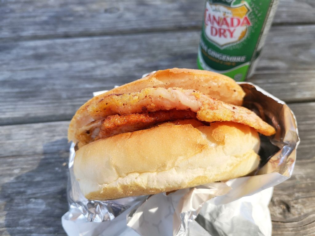 A peameal bacon sandwich on a bun