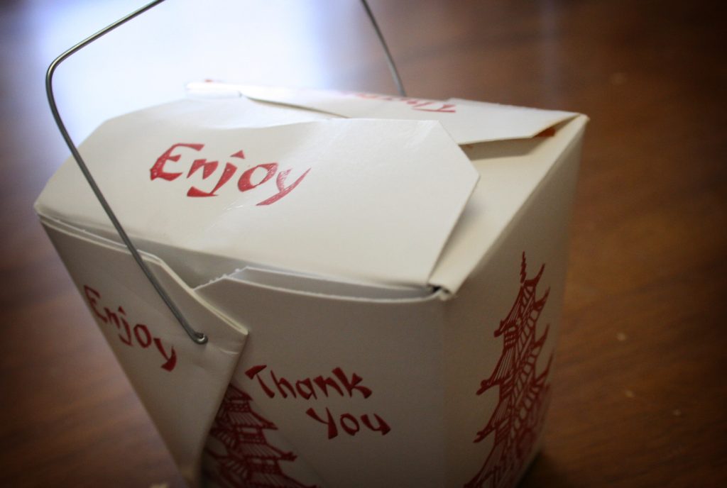 Stacked takeout food containers ready for pickup