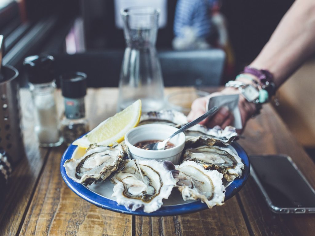 Fresh oysters in their shells on a bed of ice